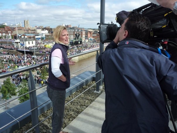 Emma Massey working as a reporter on location for the BBC