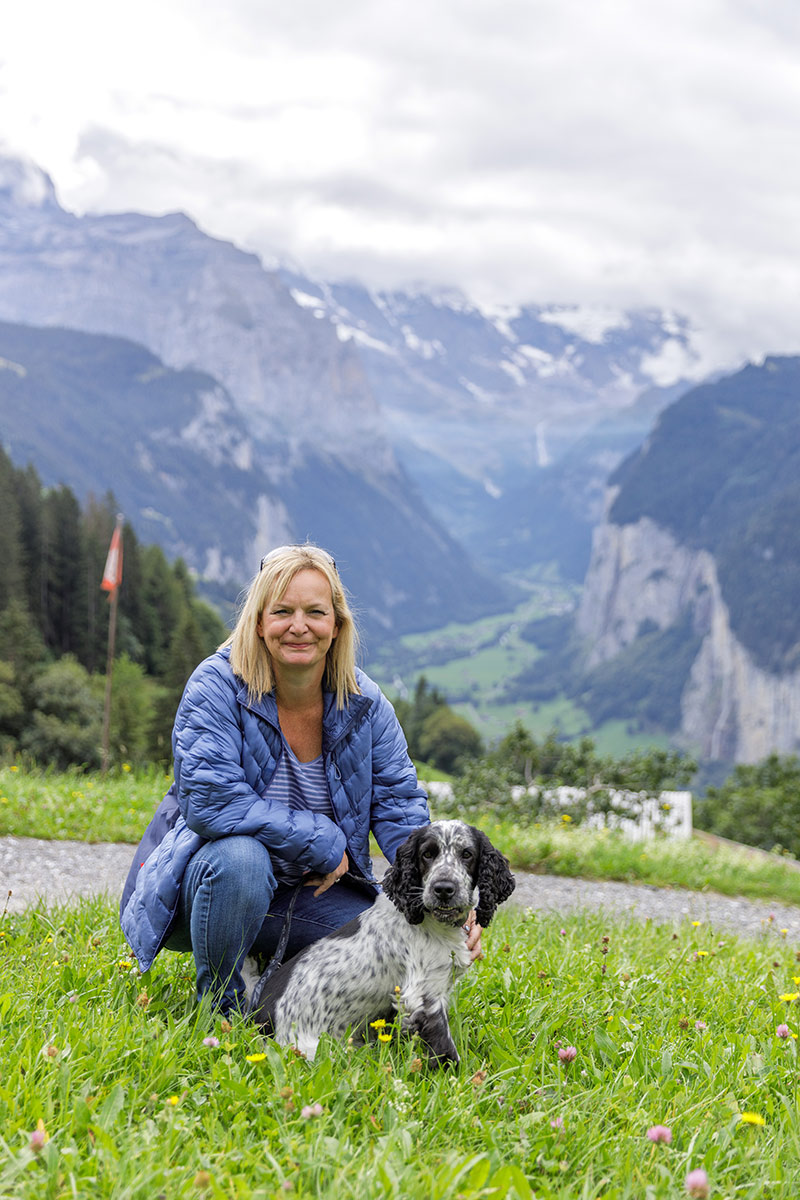 Wedding proposal videograper and photographer Emma Wilson from Story of Your Day with her dog above the village of Wengen in Switzerland
