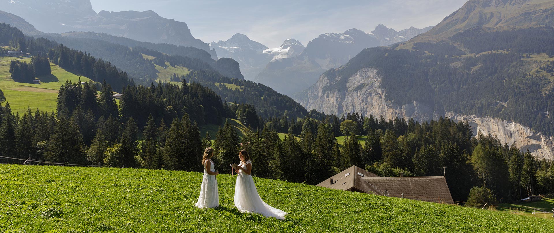Two Brides exchange vows in the hills above Wengen on their Elopment in the Jungfrau region in Switzerland