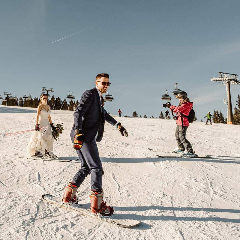 Emma Wilson from Story of Your Day films a bride and groom skiing on their wedding day